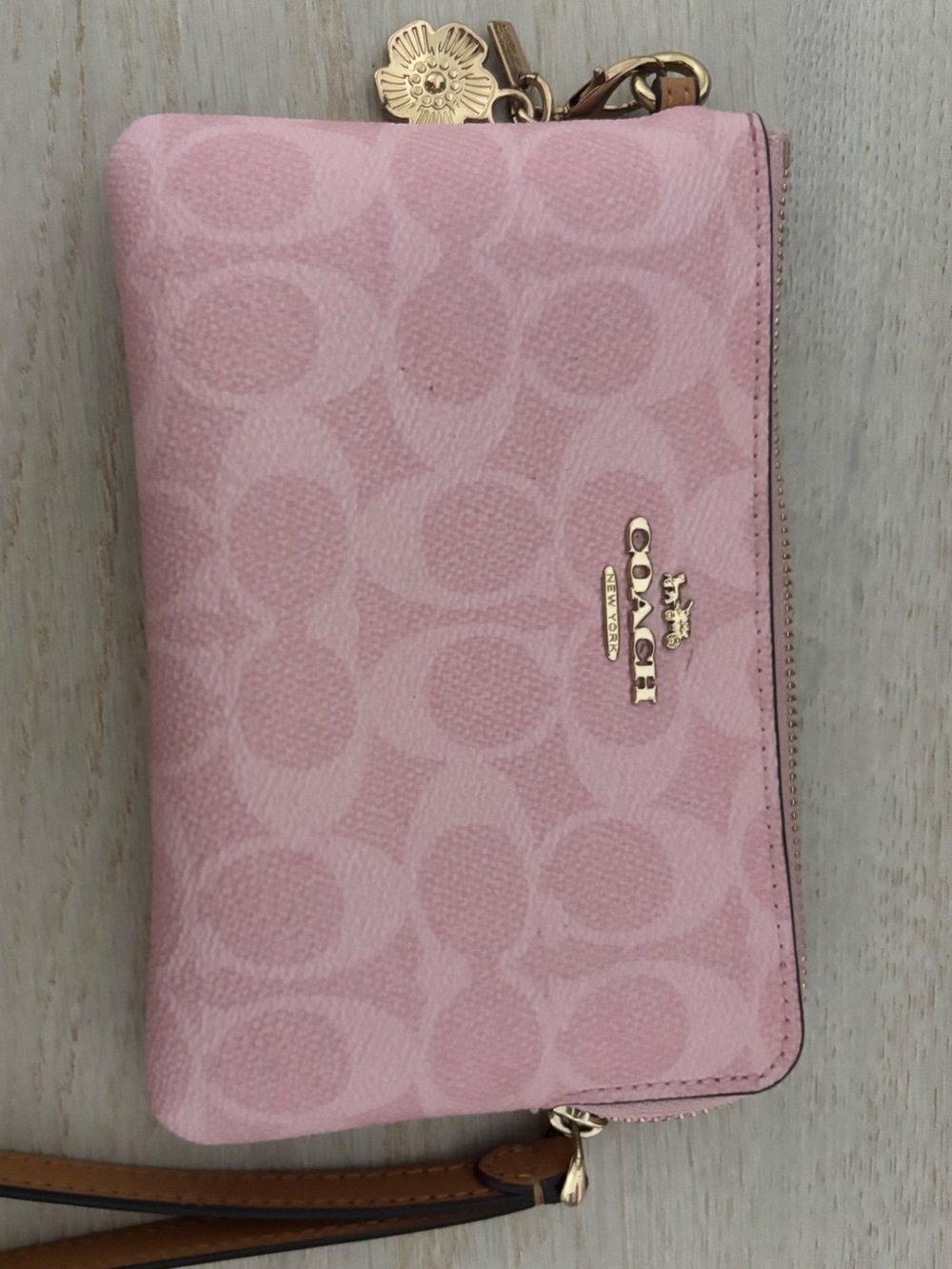 pink coach wristlet with original flower charm
